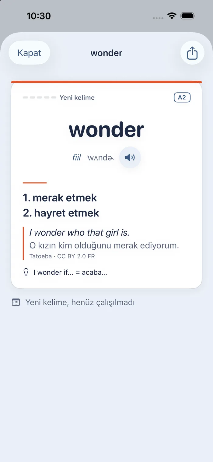 The card for wonder in the app: A2, verb; Turkish meanings merak etmek and hayret etmek; the example “I wonder who that girl is.” with its Turkish translation and its Tatoeba source.